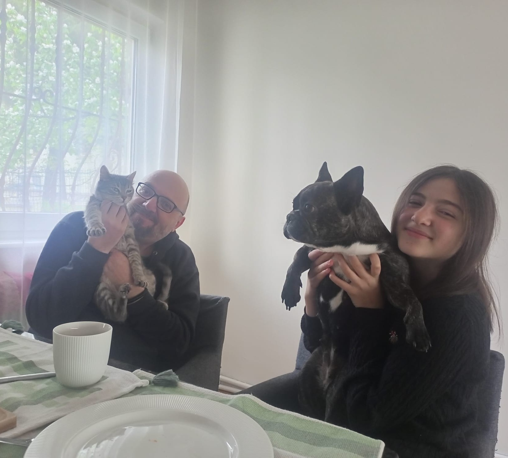 A family moment with a cat and a dog